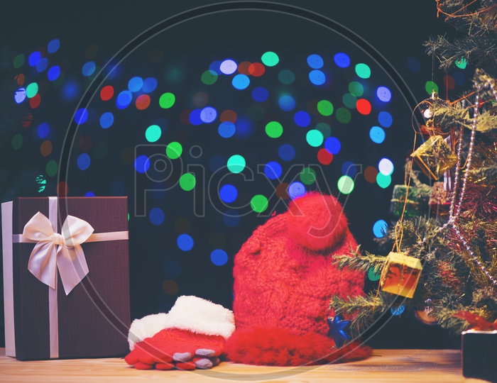 Santa Hat And  Gloves Over a Led Bokeh Background
