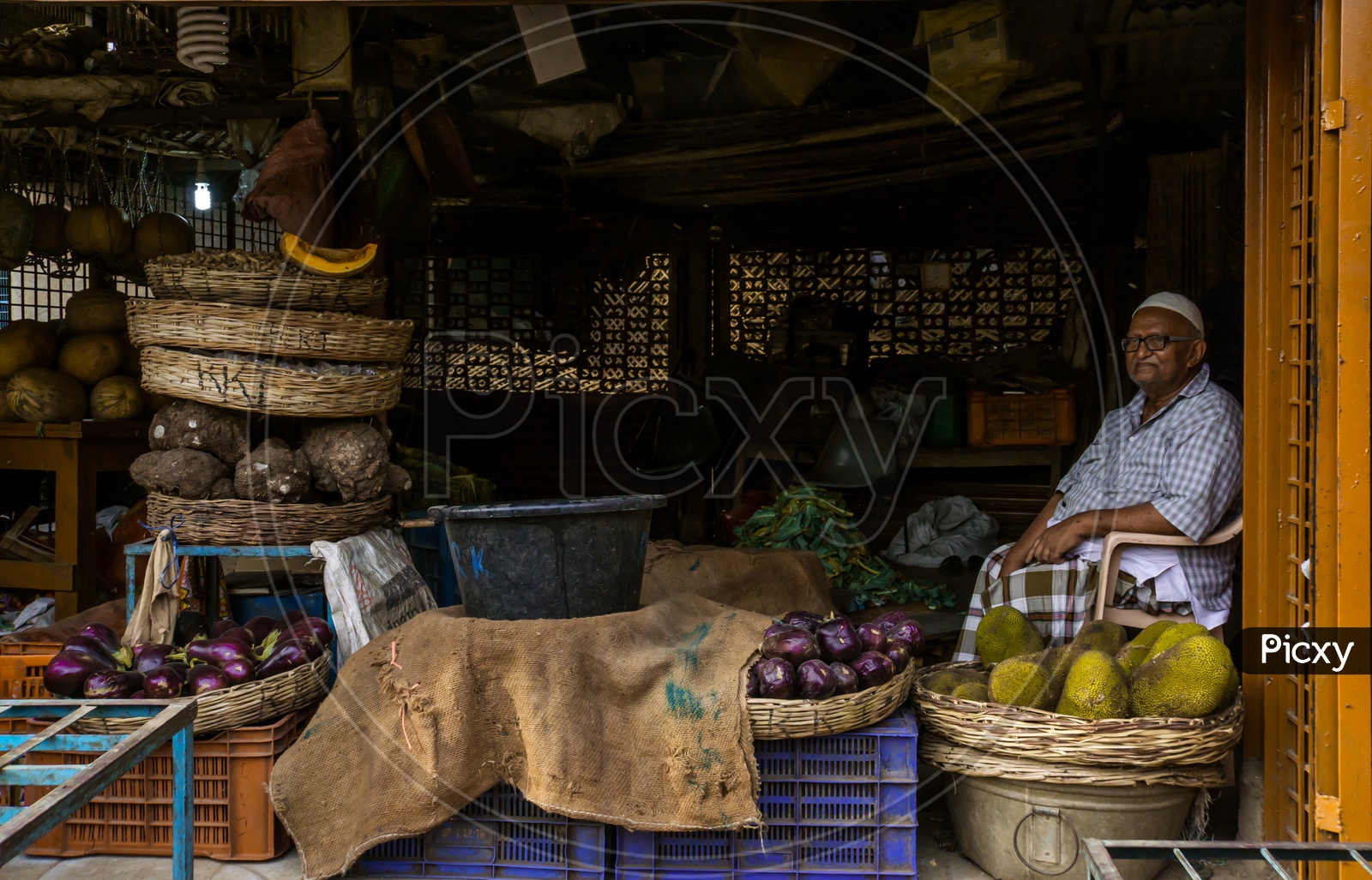 A shopkeeper in the vegetables market