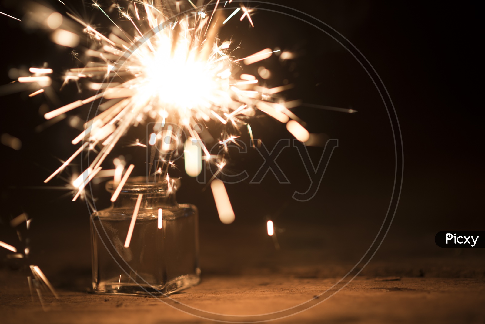 burning sparkler light In a Vase Over an Isolated Black Background