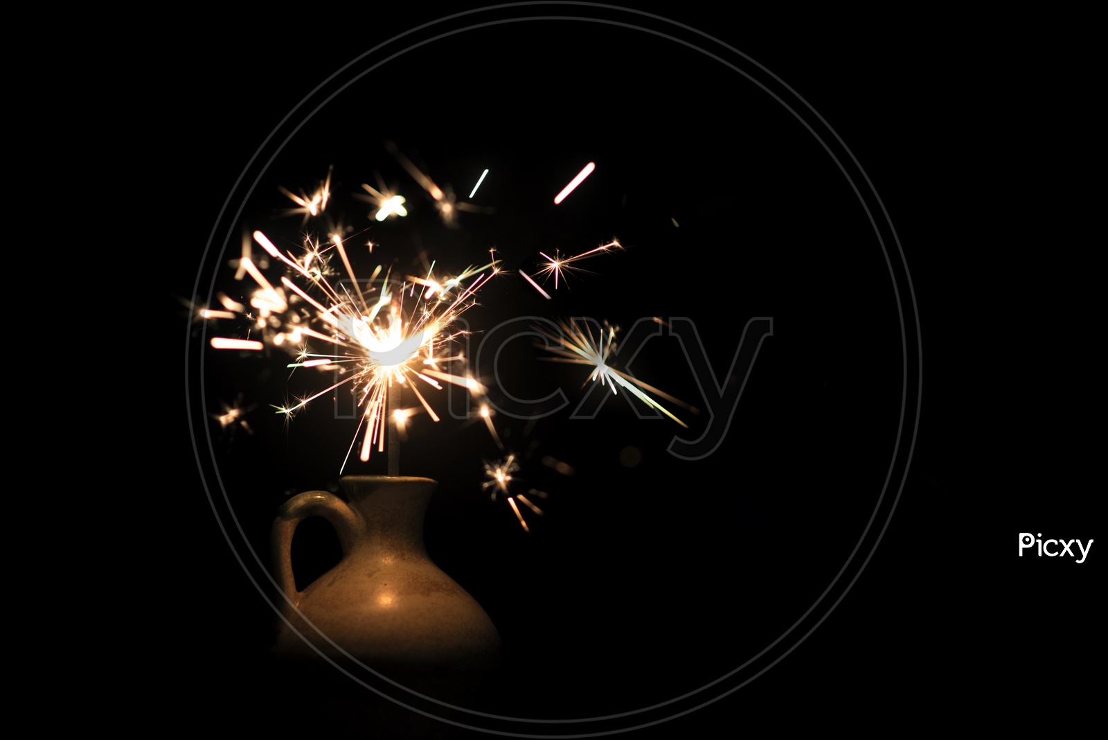 burning sparkler light In a Vase On Isolated Black Background
