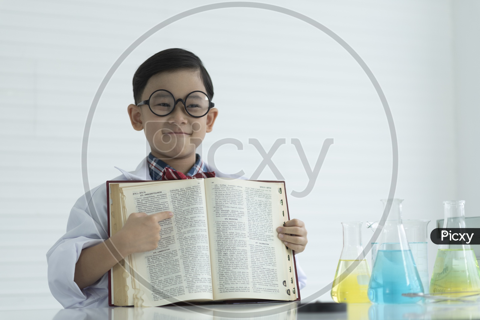 A boy showing a opening book, education concept