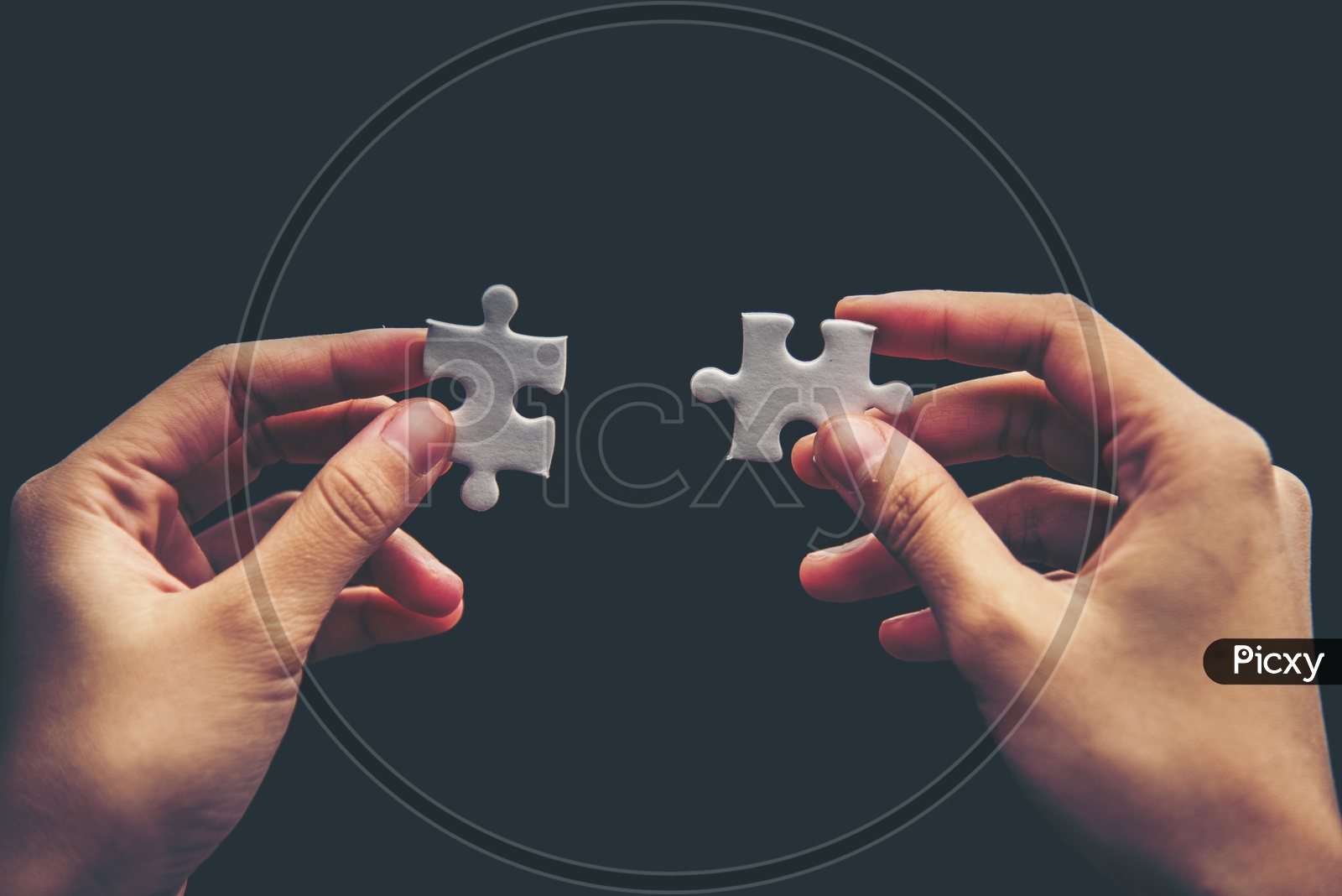 Startup  Business Entrepreneurs  hand connecting jigsaw puzzle.