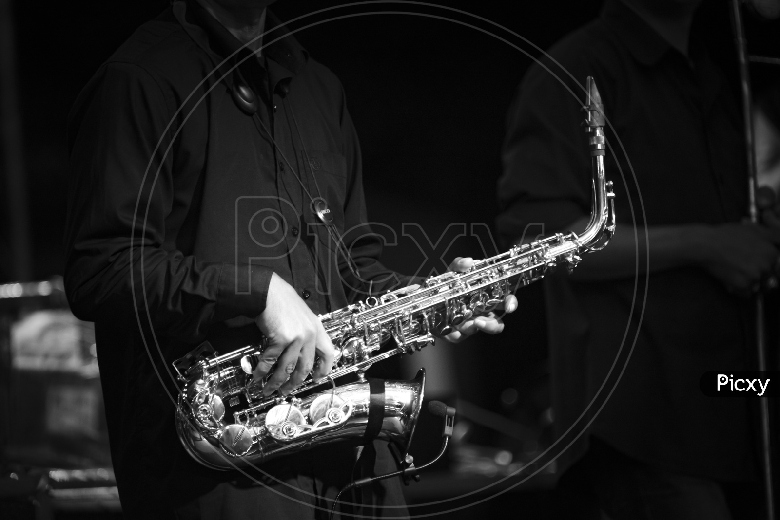 A man playing saxophone, monochrome