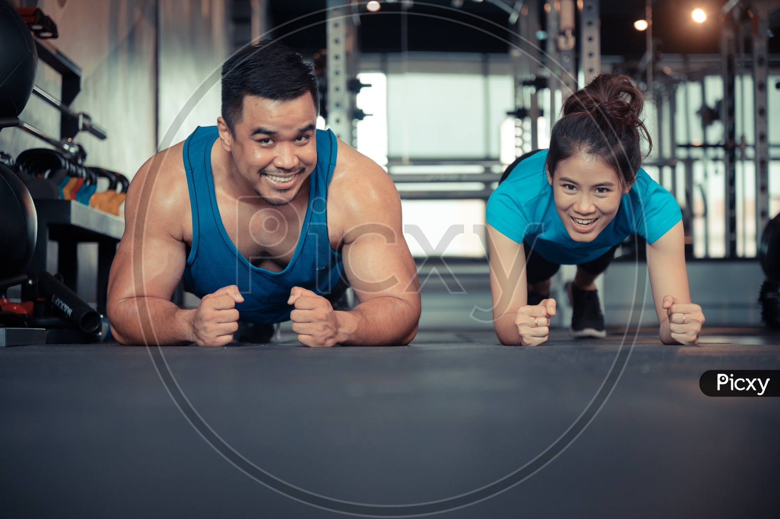 Couple exercising in the gym