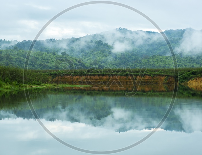 Tropical Lake With Mountains Reflection And Clouds  In Khao Yai National Park