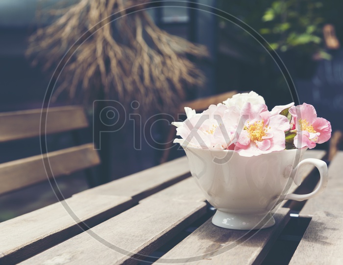 Flower Vase With Beautiful Flowers on a Cafe Table