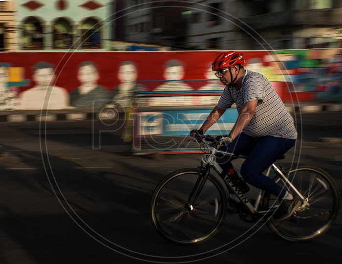 Person cycling on road