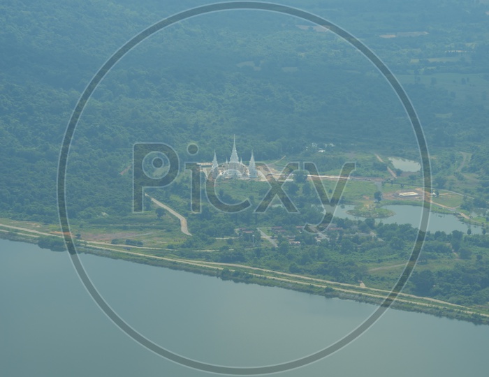 Aerial View Of River Channel With  Buddhist Temple