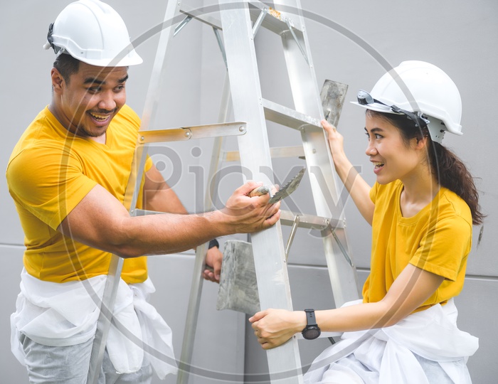 Lovely Couple in the house construction concept