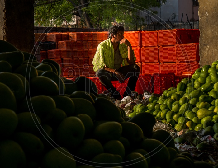 View of mangoes and seller in the market