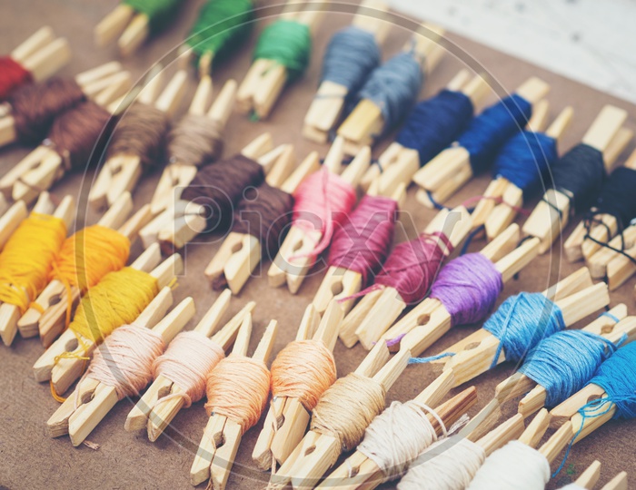 Colorful embroidery thread on an Wooden Table  With Selective Focus