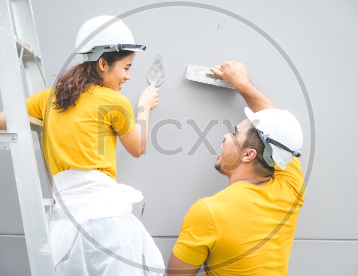 Lovely Couple in the house construction concept