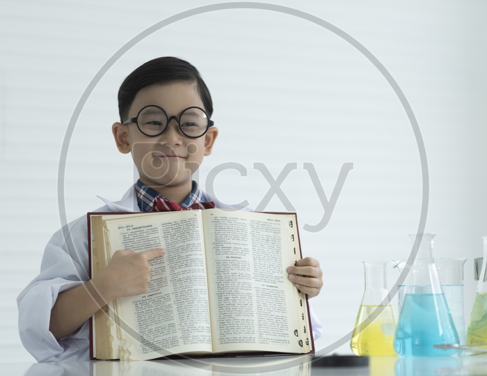 A boy showing a opening book, education concept