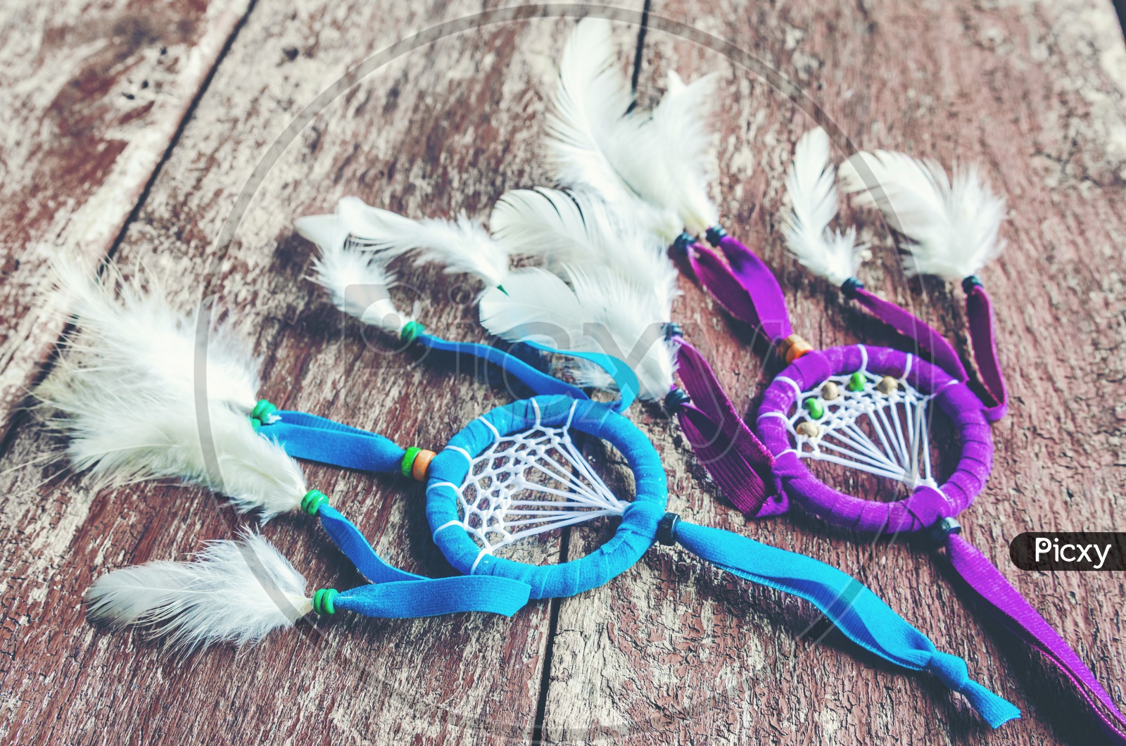 Handmade dreamcatchers with bright feathers