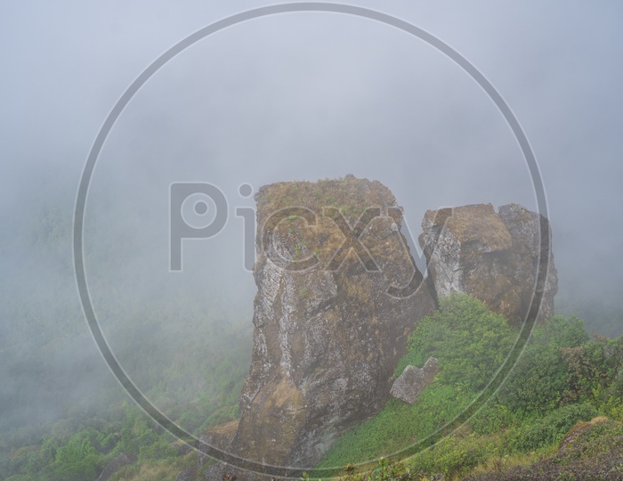 Landscape Of Doi Inthanon National Park With Rock hill With Mystic Fog All Over