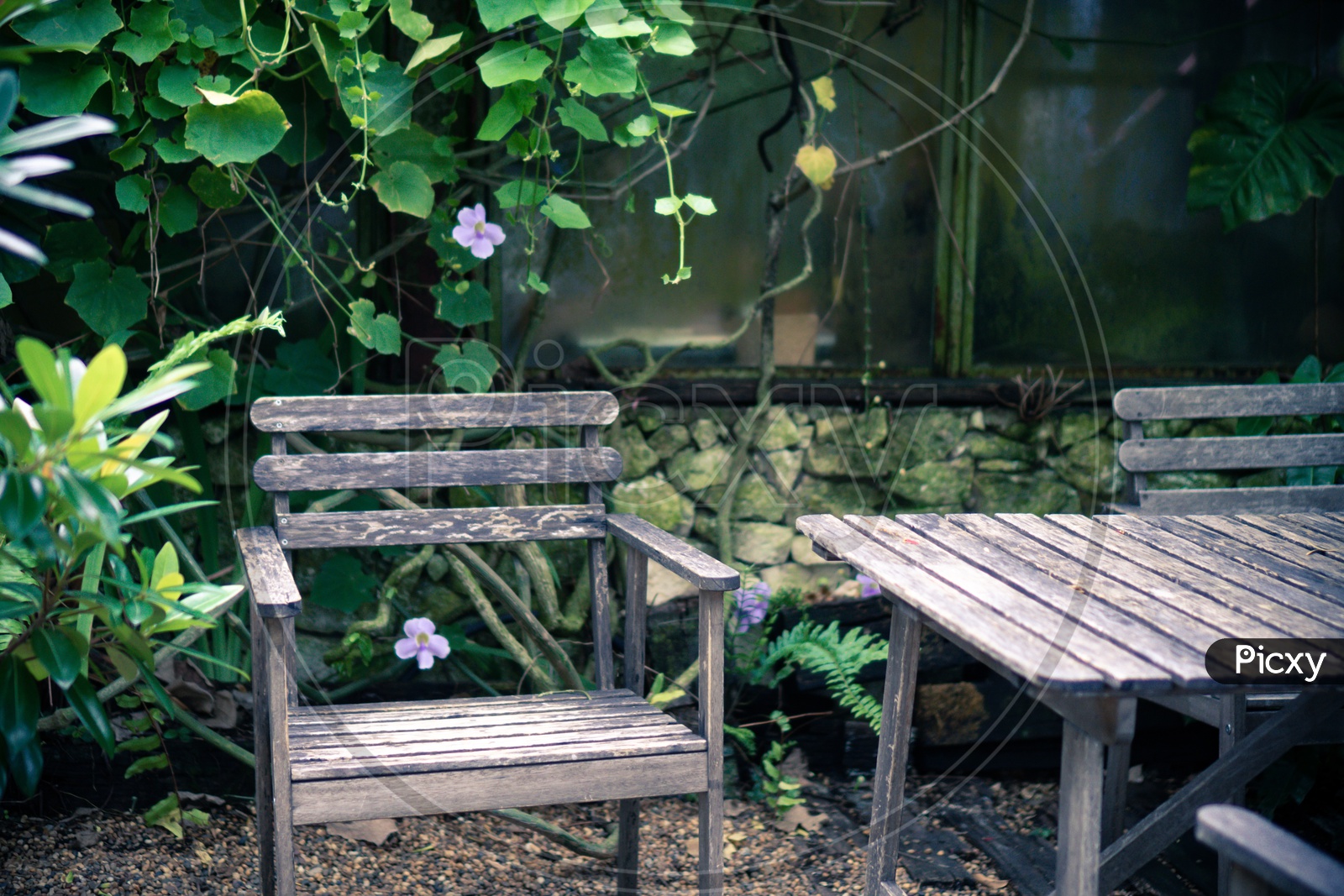 Old wooden set for outdoor furniture in tropical garden, cafe table