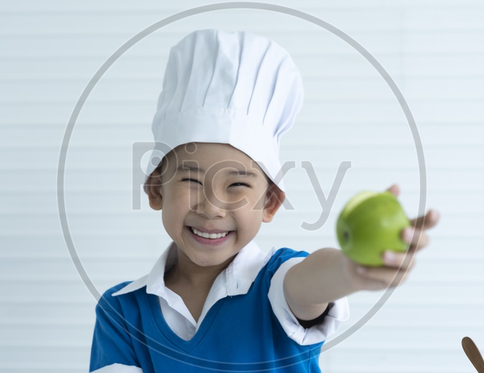 Funny Child eating apple, Little Handsome Boy with green apple,  Health food, Fruits, Enjoy Meal