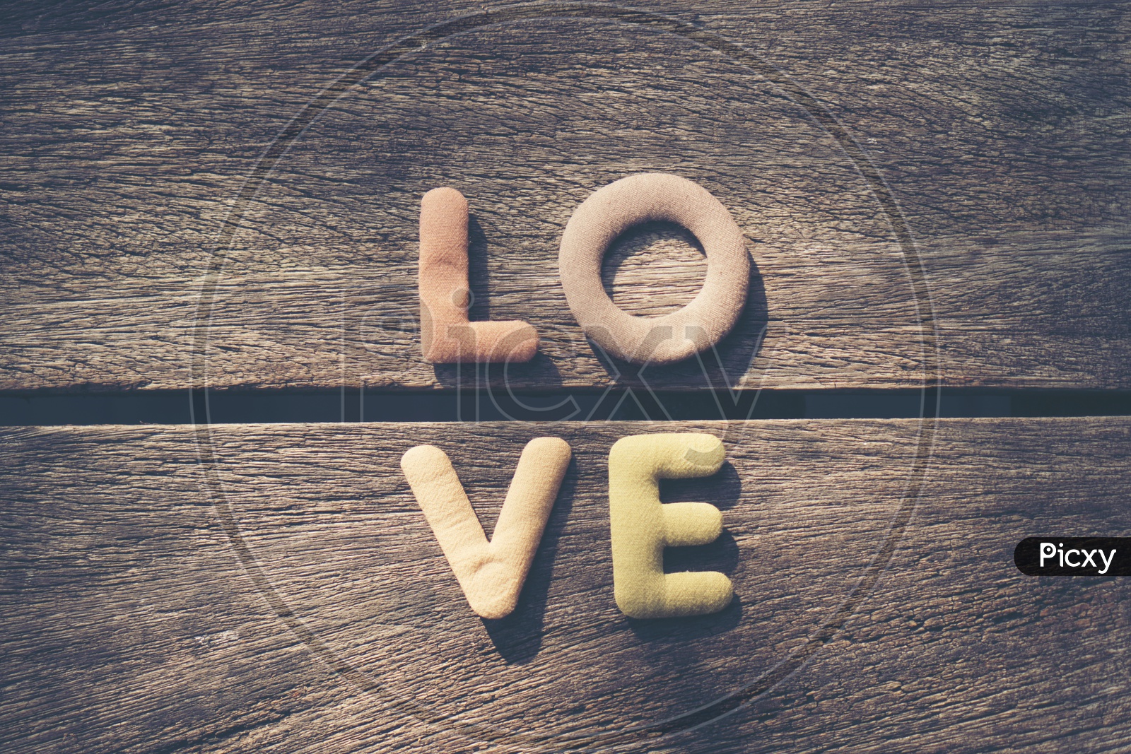 LOVE Word  On an Wooden Table Closeup With Copy Space Forming a Template For Valentine's Day
