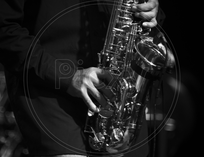 A man playing saxophone, monochrome