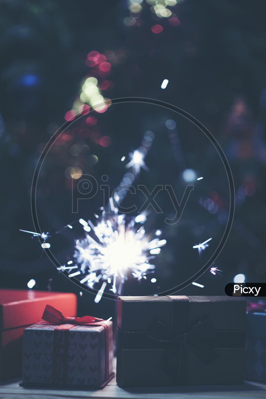 Sparkler with background Christmas lights  bokeh