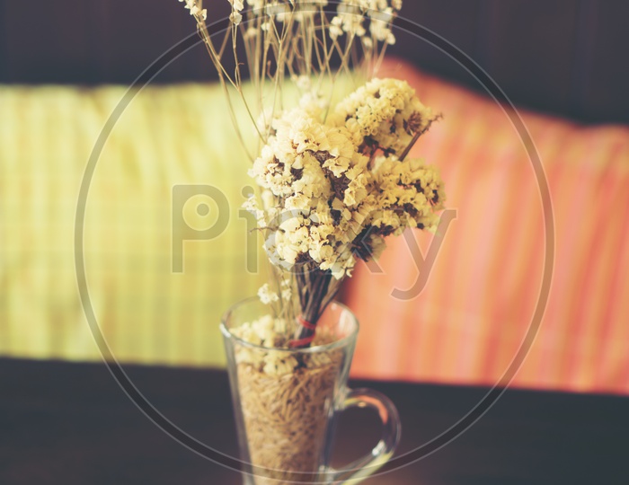 Close up of dry flowers in a glass vase vintage filter