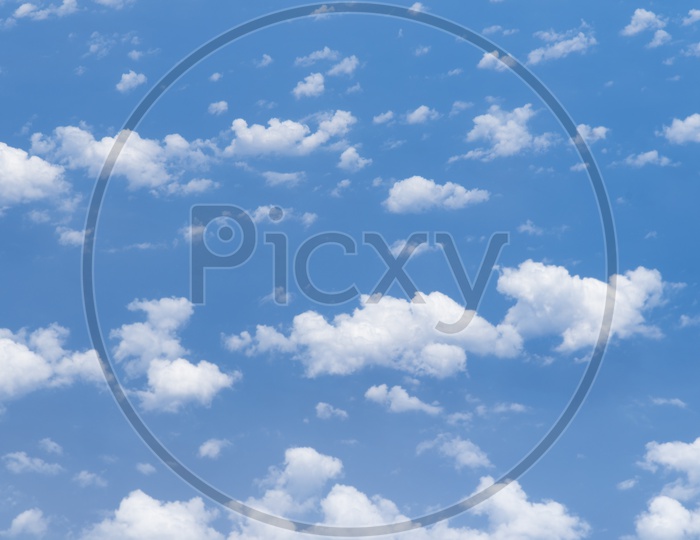 Abstract Blue Sky With Cotton Clouds  Forming a Background