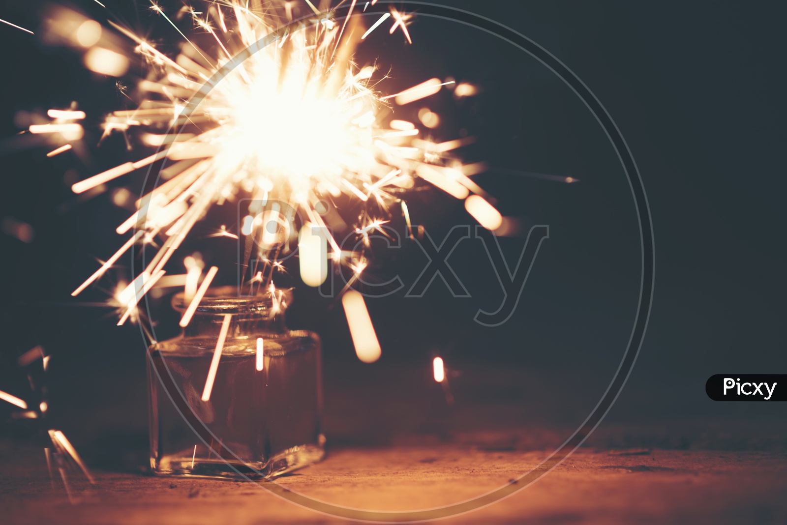 Festive Sparklers Over Black Background With Space