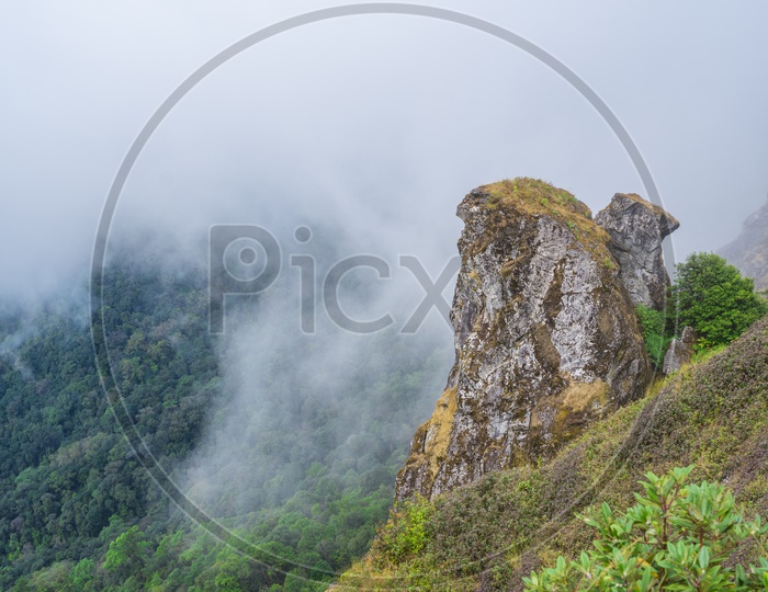 Landscape Of Doi Inthanon National Park With Rock hill With Mystic Fog All Over