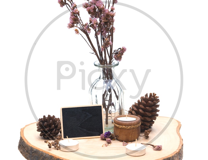 Artistic Background with Dried Vintage Pine Flowers on Wood  isolated on white background