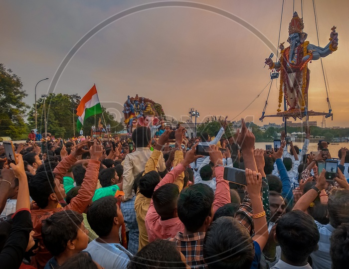 Ganesh immersion 2k19 at tank bund with Indian Flag and crowd carrying mobile