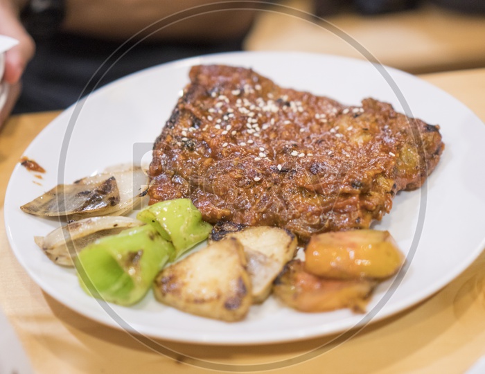 Grilled Beef Steak with Spices And Served With Grilled Veggies