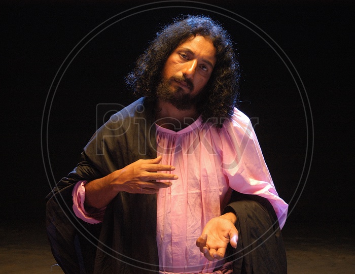 Indian man enacting as Jesus Christ with long hair