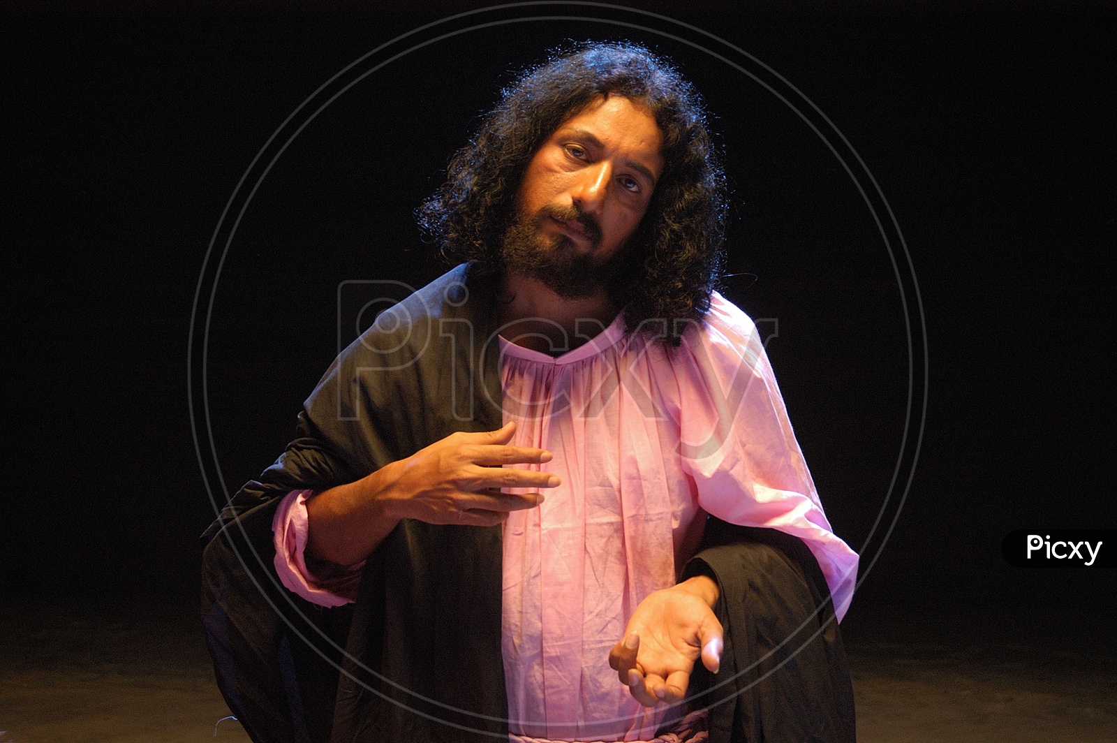 Indian man enacting as Jesus Christ with long hair