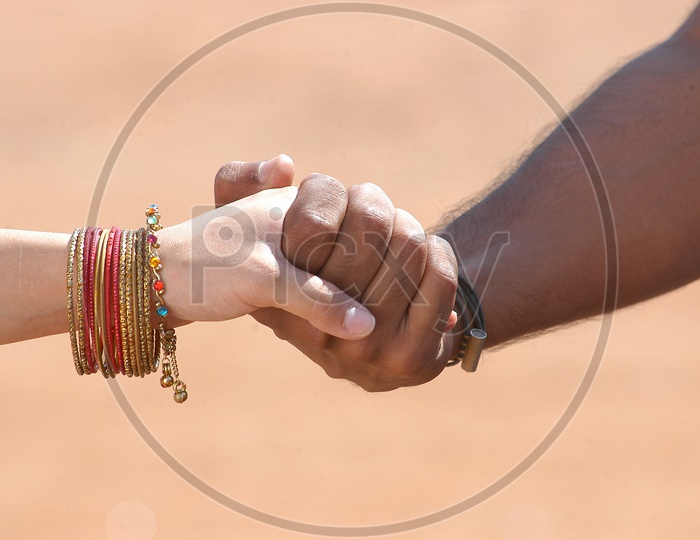 Indian Man holding a girl's hand