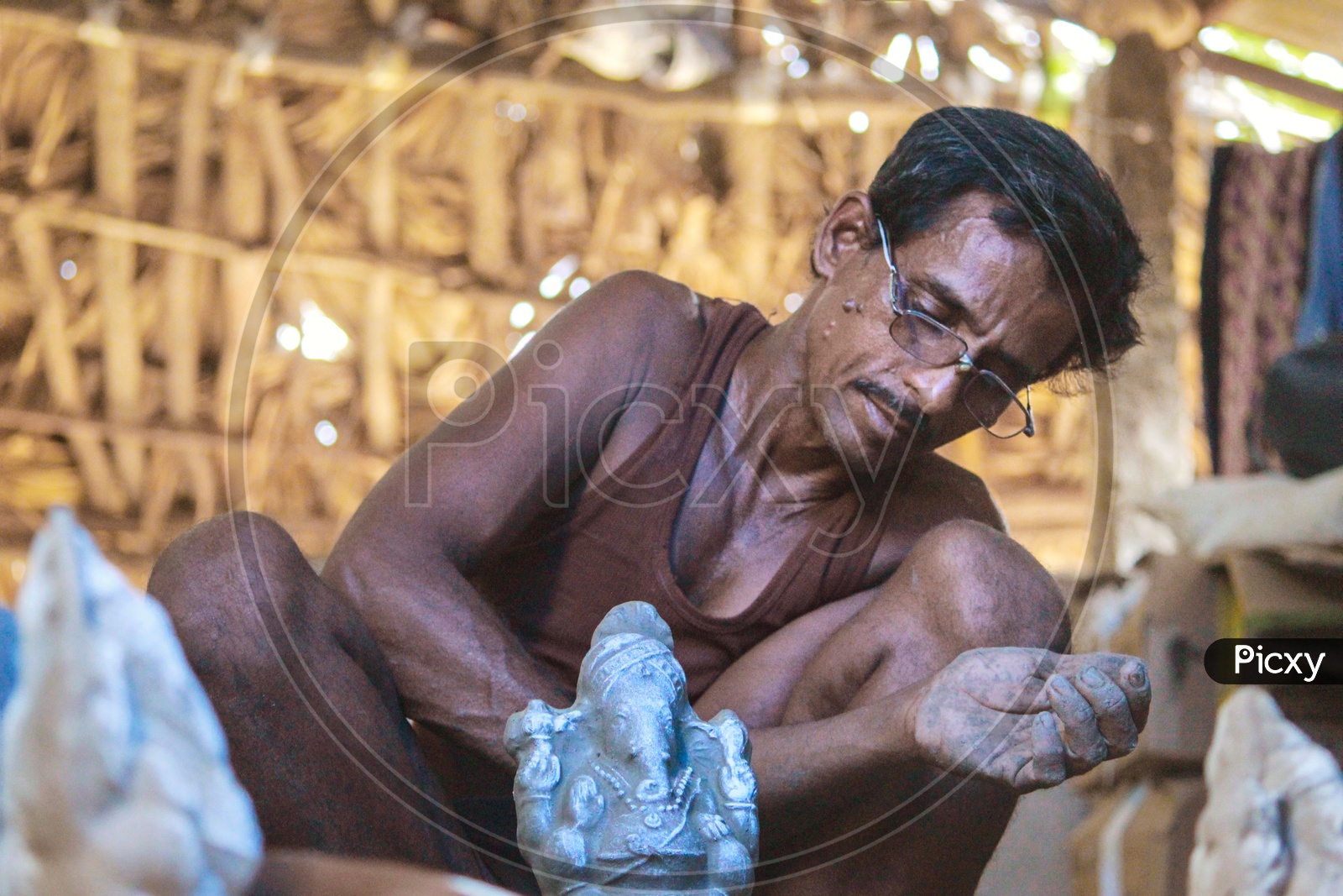 A man making eco friendly ganesh idol.