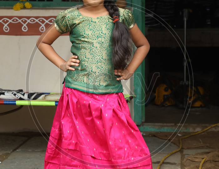 Indian little girl posing wearing traditional dress