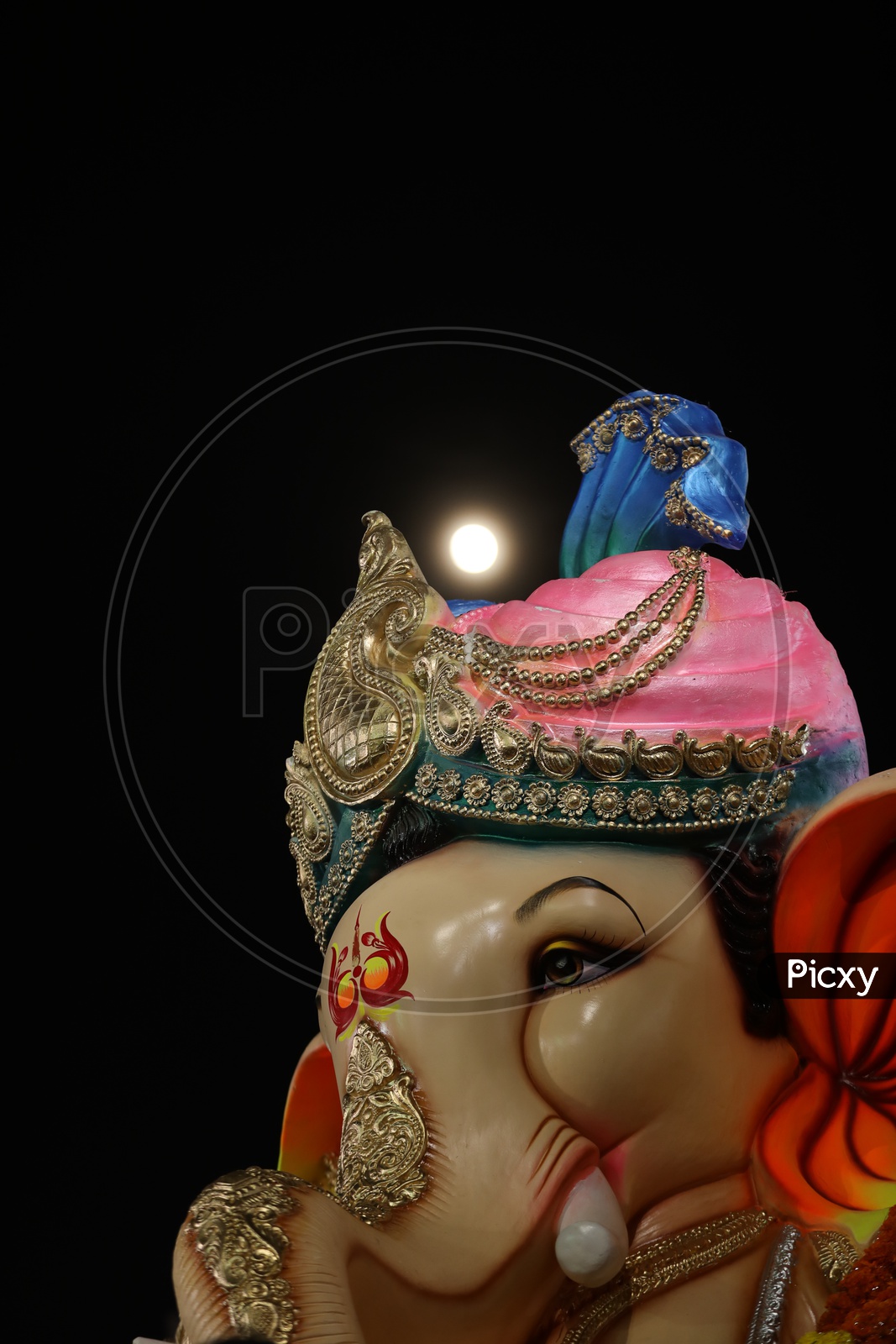 Moon raising behind Lord Ganesh's Head