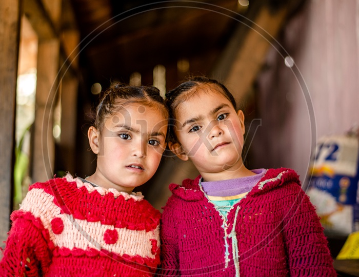 Portrait of twin himachali girls in their House
