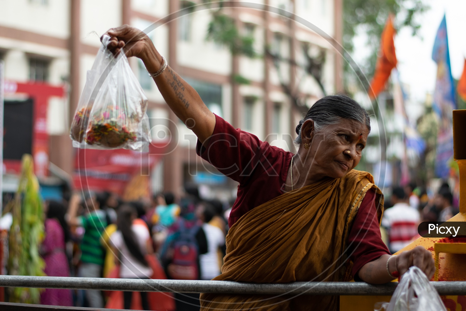 Old woman selling Pooja Items at a Hindu Temple