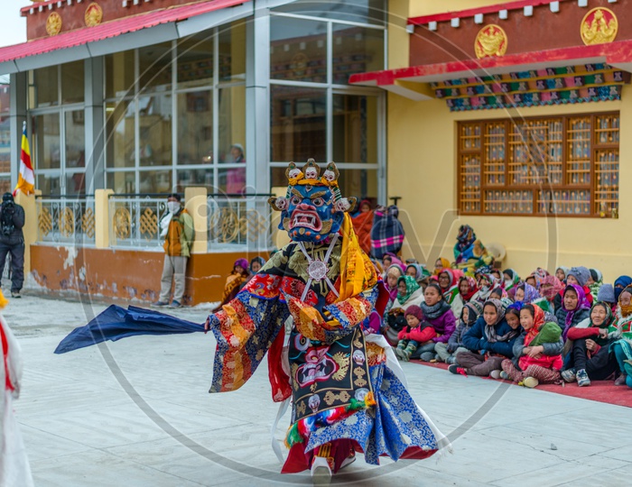 Tibetan Buddhist Lamas dressed in Mystical Mask Dance Tsam mystery in the time of festival