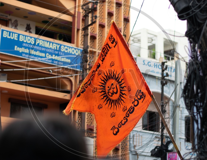 Devotee Holding OM Flag at Khairatabad Ganesh Utsav