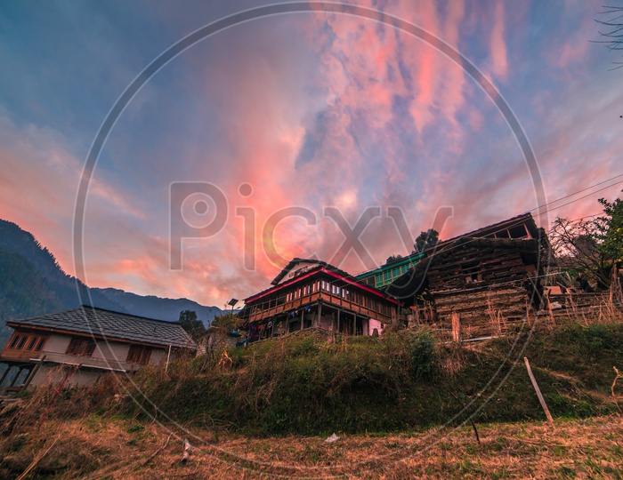 Sunset over Houses in a Rural Village in Himalayas