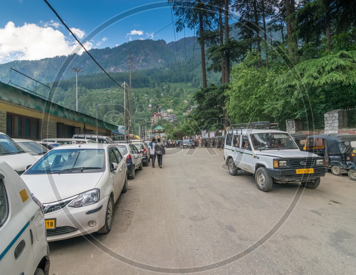 Travel Cars on Manali Road with Mountains in Background