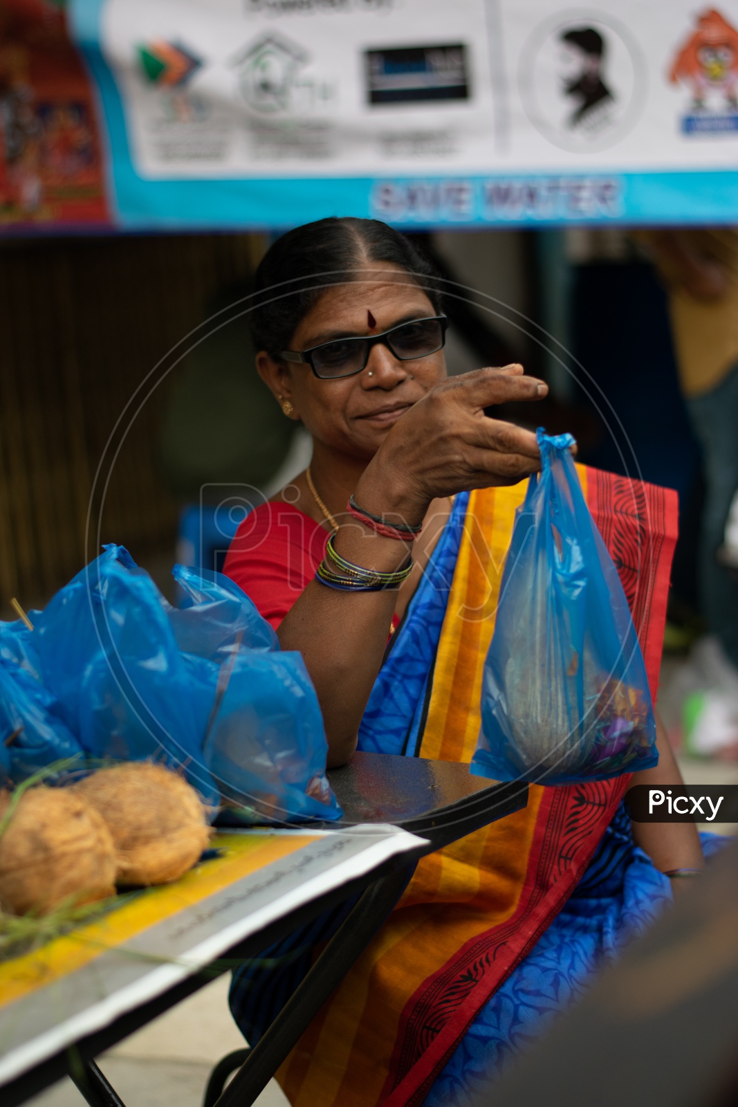 Indian Old Woman Selling Pooja Items at Khairatabad Ganesha Temple