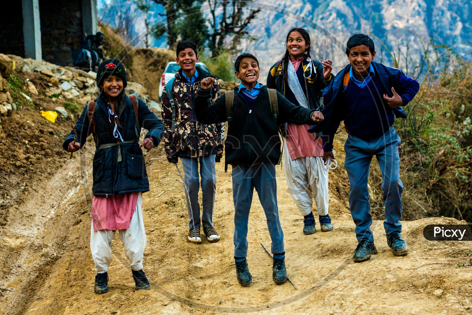 Portrait of Indian School kids jumping and Posing on the Street