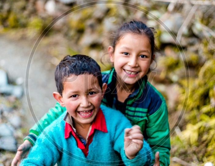 Portrait of Indian Brother and Sister Smiling and Playing