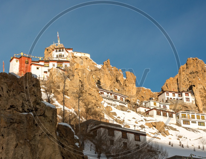 Sunrise over Dhankar Monastery on Mountain Top Covered in Snow