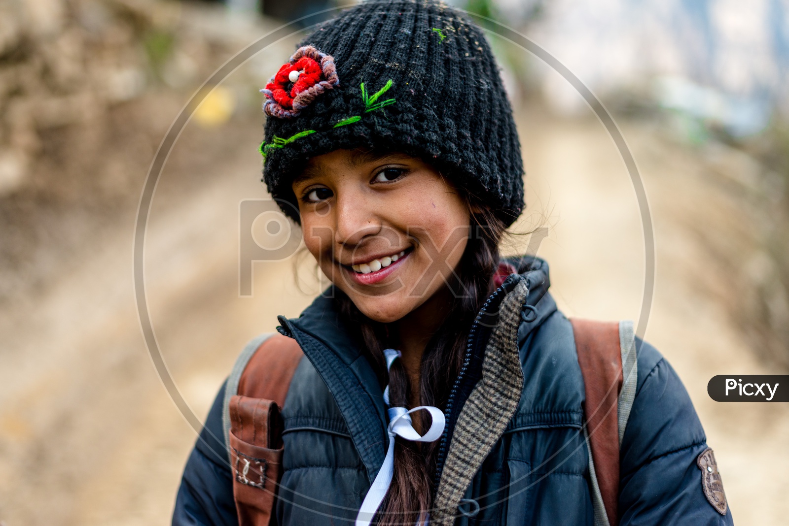 Portrait of Smiling Himachali Girl with Cap on Head