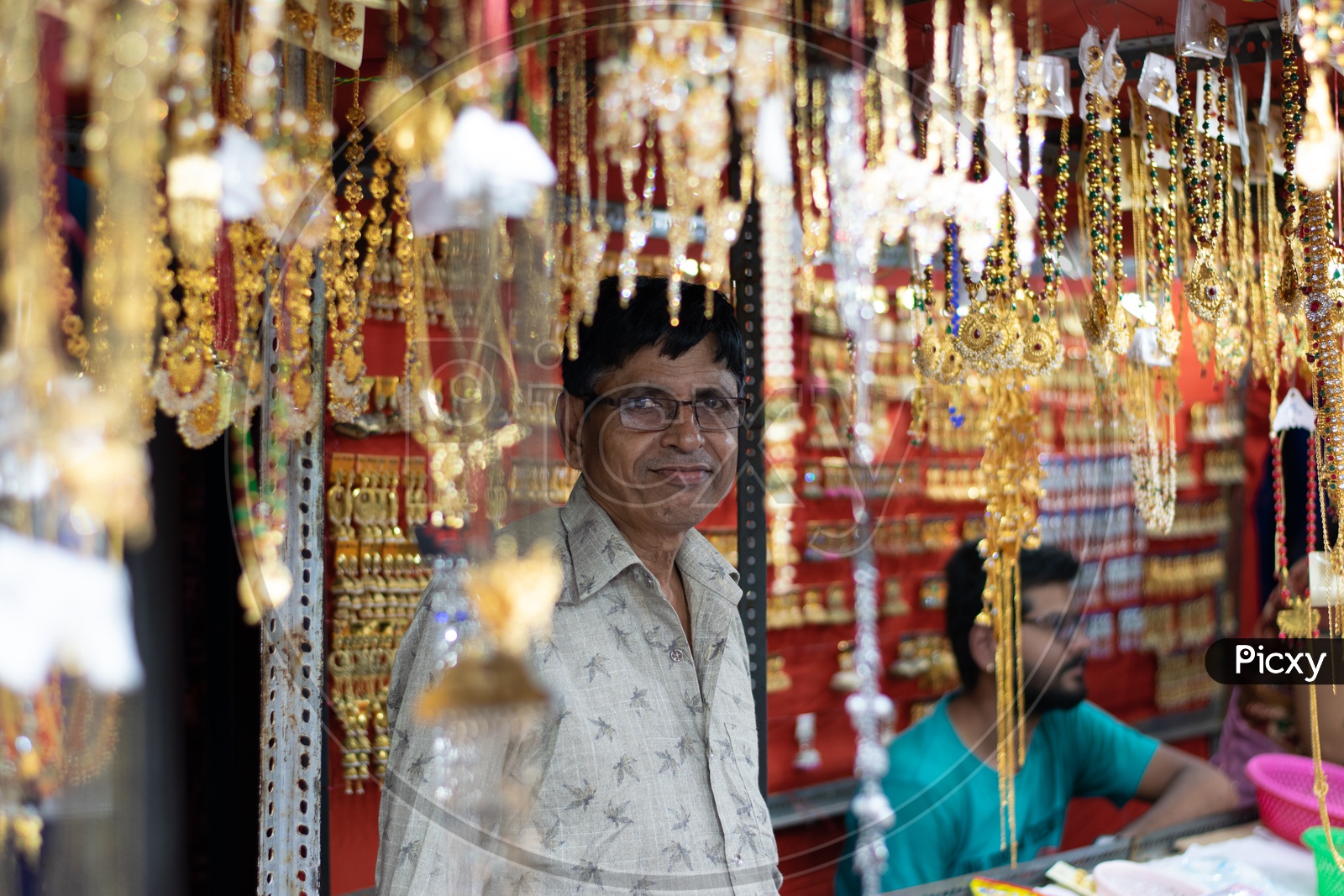 Image of Man selling Ladies Accessories in a ShopKT884751Picxy