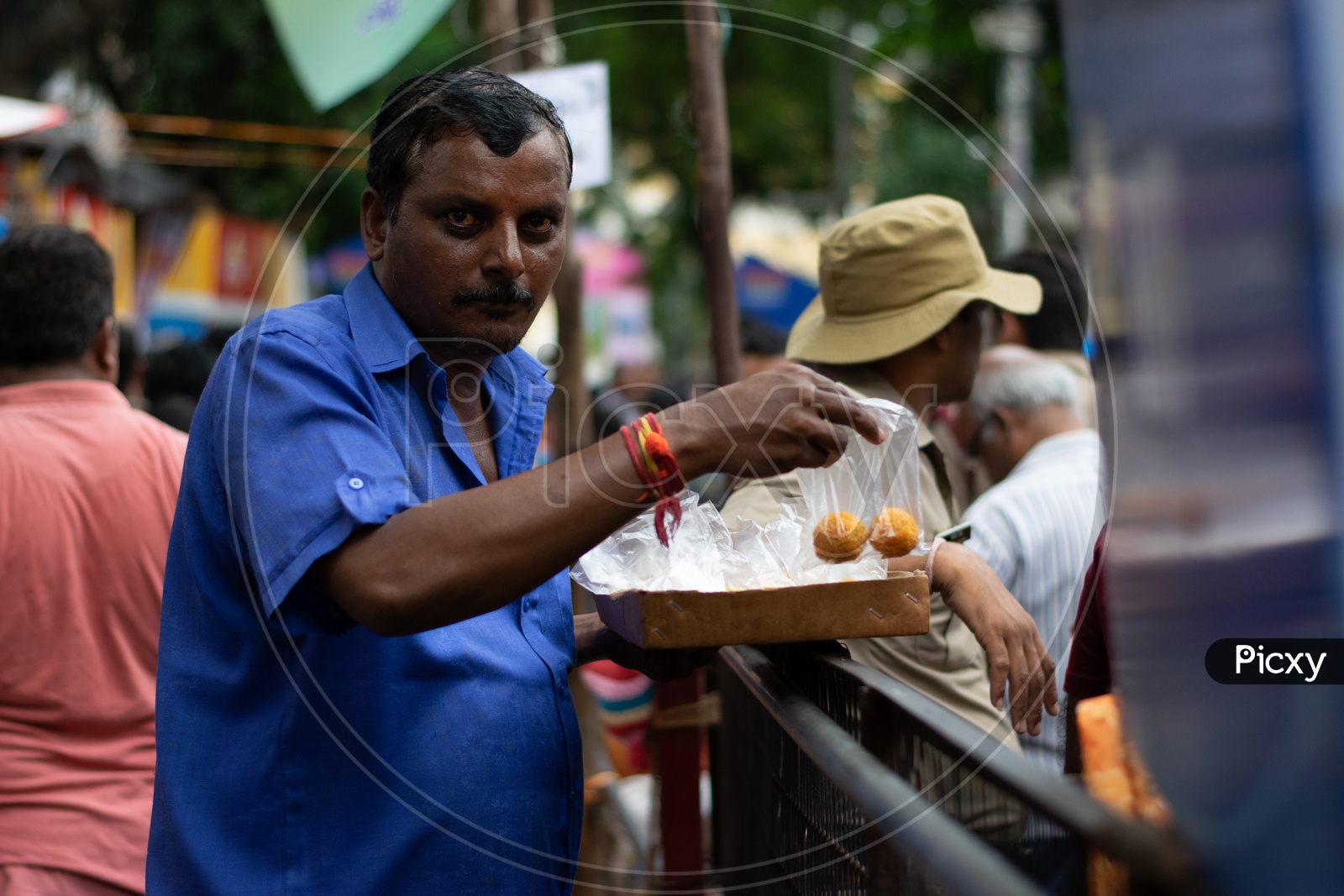 Street Vendor Selling Laddus or Ladoo to Devotees at Khairatabad Ganesha Temple